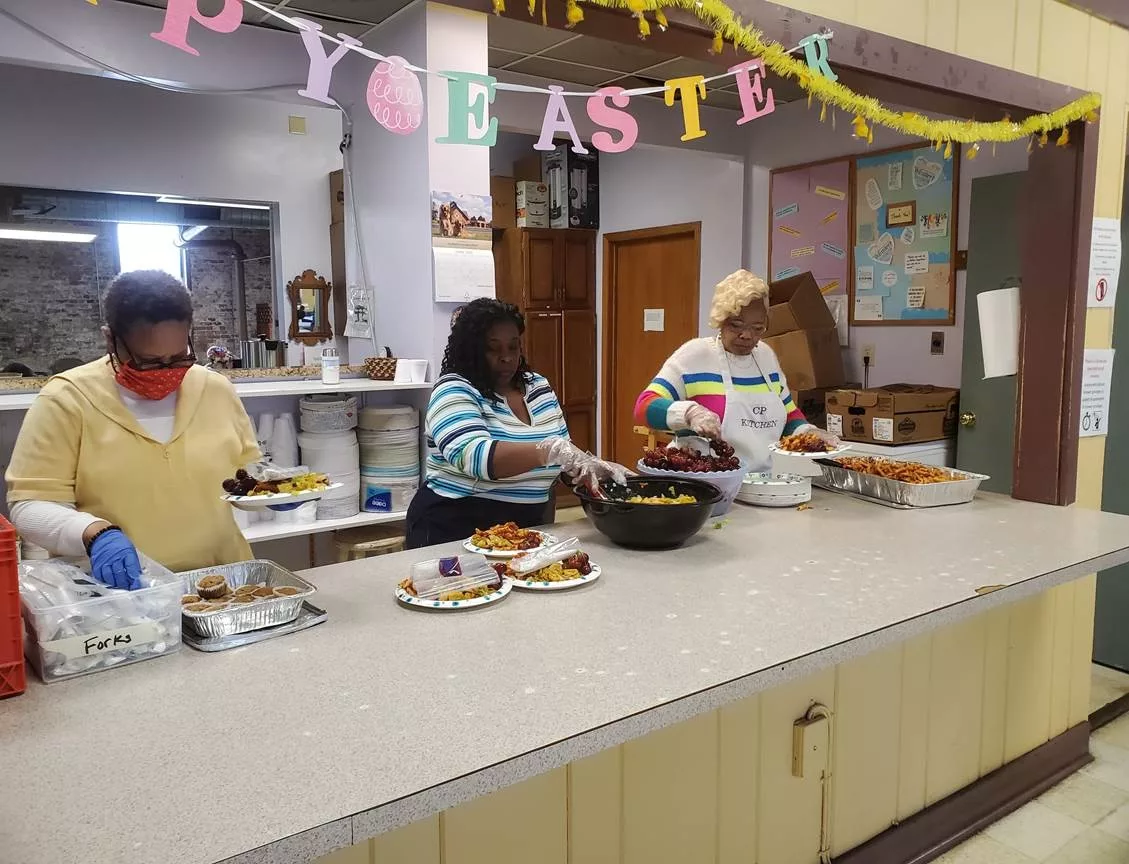 Volunteers preparing to serve lunch on April 3rd at the Carpenter&rsquo;s Place